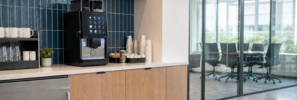 Azkoyen Vitro X5 commercial coffee machine in a professional office breakroom